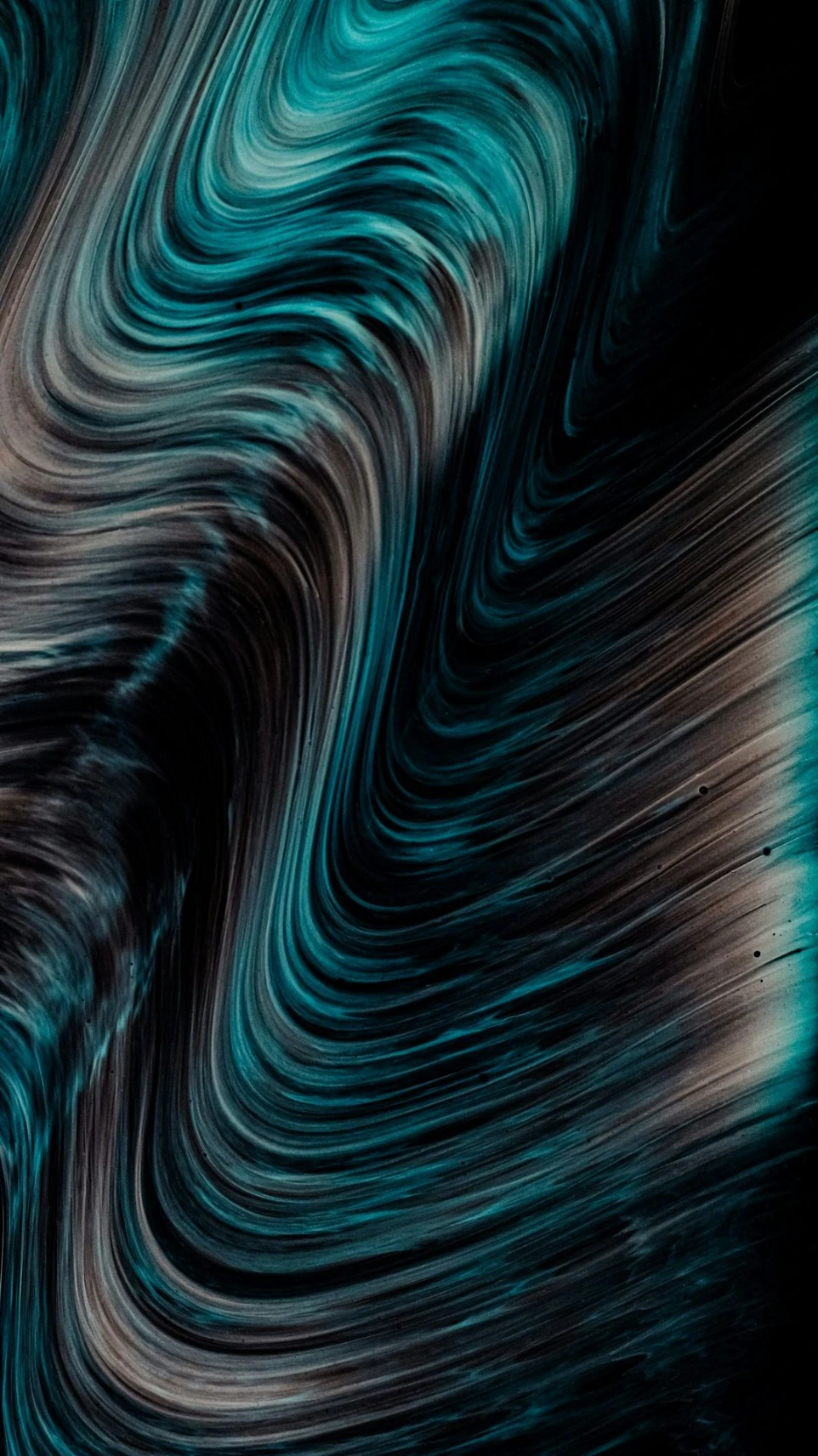 a black background with a blue and white swirl